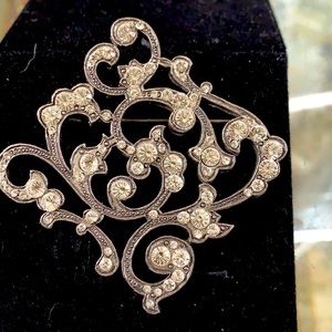 Silver and Swarovski brooch.